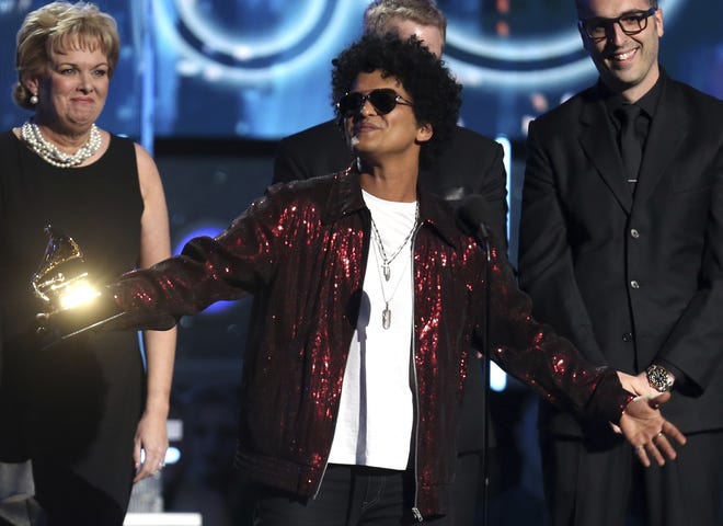 Bruno Mars accepts the award for record of the year for "24K Magic" at the 60th annual Grammy Awards at Madison Square Garden on Sunday, Jan. 28, 2018, in New York. [Photo by Matt Sayles/Invision/AP]