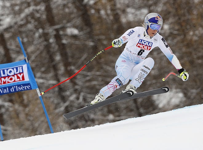 FILE - In this Dec. 16, 2017, file photo, United States' Lindsey Vonn competes during a women's World Cup super-G race in Val d'Isere, France. Vonn has some unfinished business on her agenda as she heads to the Pyeongchang Olympics. That includes trying to win more medals after missing the last Olympics because of a bad knee. (AP Photo/Gabriele Facciotti, File)