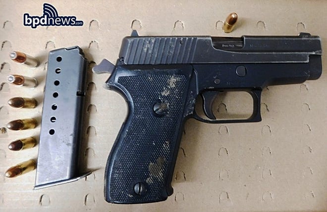 Boston police say they seized this 9mm Sig Sauer handgun loaded with seven rounds in possession of a Stoughton man, Saturday, Jan. 27, 2018. (Boston police photo)