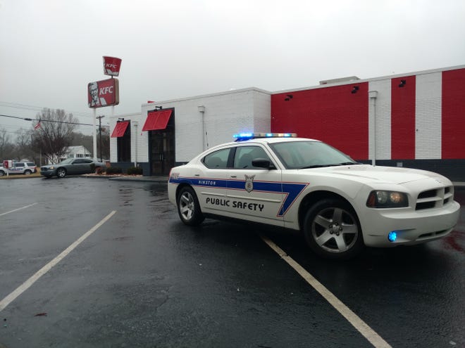 Kinston Police department investigate an armed robbery Monday at KFC on Vernon Avenue. [Janet S. Carter/ The Free Press]
