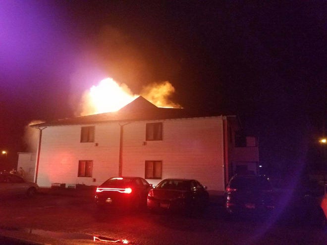 PHOTO COURTESY OF KIM DONALDSON Fire rages early Jan. 23 at Stratford Arms Apartments in East Peoria.