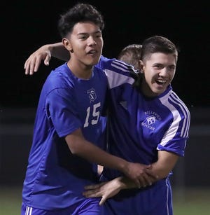 Belleview's Jose Avellaneda (15) celebrates a goal with teammate Ivan Gonzalez. [Bruce Ackerman/Staff photographer]