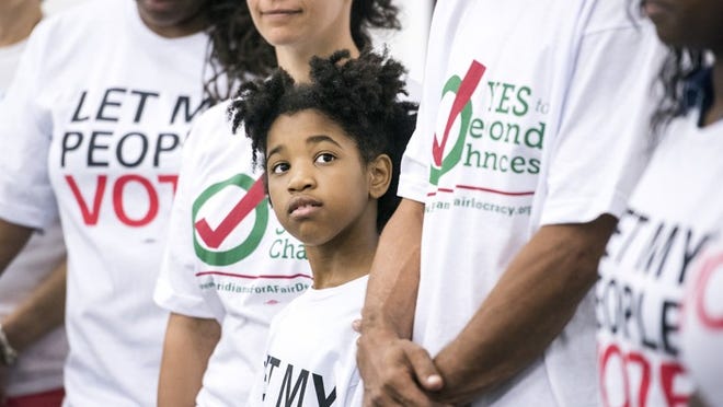 People at a rally last year urging the restoration of voting rights for ex-felons. (Melanie Bell / The Palm Beach Post)