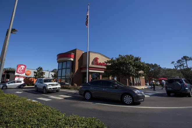 Customers wait in the Chick-fil-A drive-through on Archer Road. The company is working with city planners and is expected to build a new restaurant about a half-mile away from its current location on the other side of Archer Road. [LAUREN BACHO/Special to the Guardian]