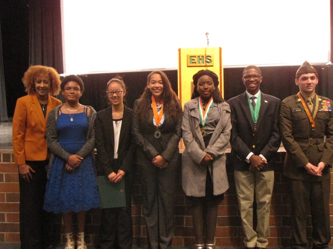 English teacher Selby Rich, from left, of Eastside High School, with oratorical contest contestants Zahira Harris, Jane Huang, Breanna Coffill, Crystal Tennell, Ronald Cobb II, and Young Marine Master Sgt. Nathan Crawford. [Aida Mallard/Special to the Guardian]
