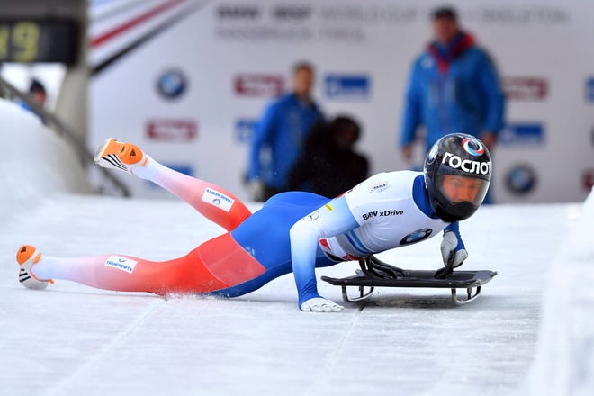 FILE - In this Dec. 15, 2017 file photo Russia’s Alexander Tretiakov struggles to start his first run in the men’s Skeleton World Cup race in Innsbruck, Austria. The Court of Arbitration for Sport ruled on Thursday, Feb. 1, 2018 to reinstate Tretiakov as gold medal winner of the men’s skeleton at the 2014 Sochi Winter Olympics. (AP Photo/Kerstin Joensson, file)