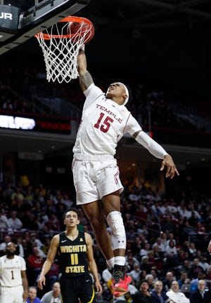 Temple's Nate Pierre-Louis goes up for the dunk during the second half of an NCAA basketball game against Wichita State, Thursday, Feb. 1, 2018, in Philadelphia. Temple won 81-79 in overtime. (AP Photo/Chris Szagola)