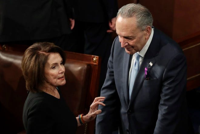 House Minority Leader Nancy Pelosi of California talks with Senate Minority Chuck Schumer of New York before the State of the Union address to a joint session of Congress on Capitol Hill in Washington on Tuesday.
