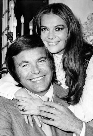 FILE - In this April 23, 1972 file photo, actor Robert Wagner and his former wife, actress Natalie Wood, pose at the Dorchester Hotel in London, England. Investigators are now calling Wagner a "person of interest" in the 1981 death of his wife Natalie Wood. Mystery has swirled around Wood's death. It was declared an accident but police reopened the case in 2011 to see whether Wagner or anyone else played a role (AP File Photo)