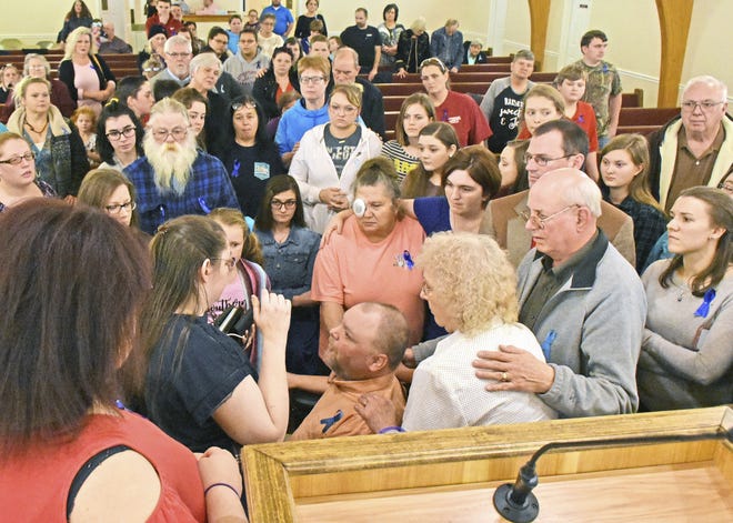 Tia and Tracy Farmer, second and third from left, thank everyone for their support during the prayer vigil for their missing 16-year-old daughter, Arissa Farmer, held Wednesday, Jan. 31, 2018, at NEA Baptist Church in Trumann. Arissa was found early Thursday in O'Neill, Nebraska. (Staci Vandagriff/The Jonesboro Sun via AP)