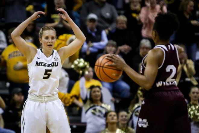 Missouri point guard Lauren Aldridge (5) pumps up the crowd during the 15th-ranked Tigers' 57-53 loss to No. 2 Mississippi State on Thursday at Mizzou Arena. [Hunter Dyke/Tribune]