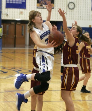 Horseheads' Jillian Casey attempts a layup around an Ithaca defender on Thursday. [SHAWN VARGO/THE LEADER]
