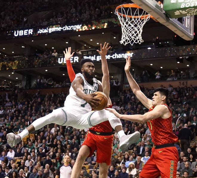 Celtics guard Jaylen Brown drives to the basket during the second half of Boston's 119-110 win over the Hawks on Friday night.