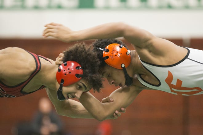 East's Dontrell Johnson, left, beat Freeport's Keondre Jackson 24-17 in their 132-pound match during the NIC-10 Varsity Conference match at Boylan Catholic High School on Saturday, Jan. 27, 2018, in Rockford. [SCOTT P. YATES/RRSTAR.COM & THE JOURNAL-STANDARD STAFF]