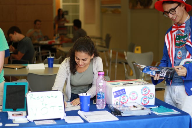 Students from the University of Florida’s Bob Graham Center for Public Service register voters during National Voter Registration Day in 2016. [Submitted photo]