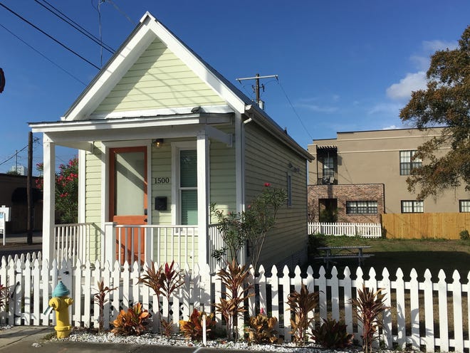 Seen in a Jan. 23 photo, David Bailey built this tiny house in Ybor City, Fla., and plans to break ground on a second soon. It has 365 square feet on the ground floor and a small loft for a home office above. Rental demand through Airbnb has been strong, he says. [RICHARD DANIELSON / ASSOCIATED PRESS]