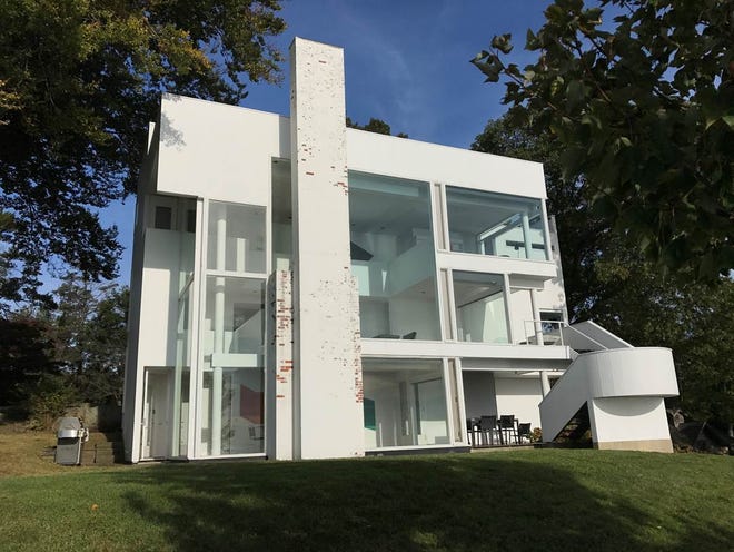 A modernist home designed by architect Richard Meier and built in 1967 has been listed for sale in Darien, Conn. [Chuck Smith via AP]