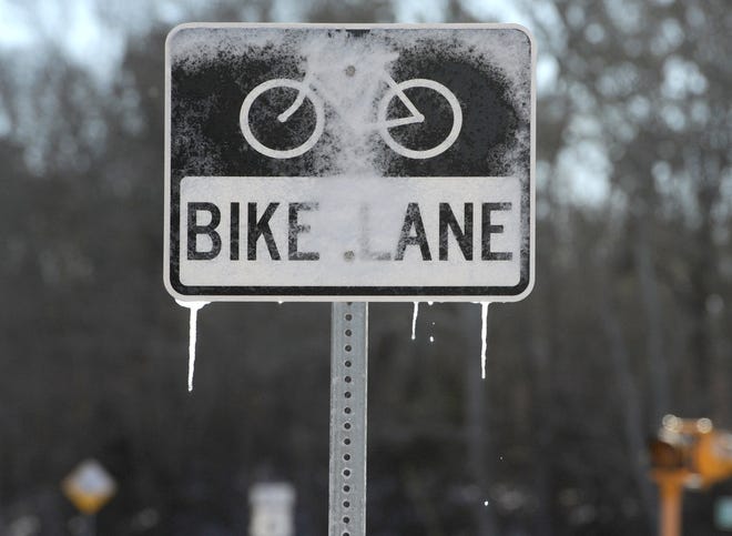 Big meltdown along Rt 6 as a bike sign drips with icicles from the morning sun.
