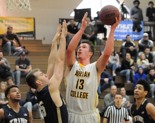 Adrian College senior Justin Webster (13) shoots during Saturday’s MIAA game against Trine University.