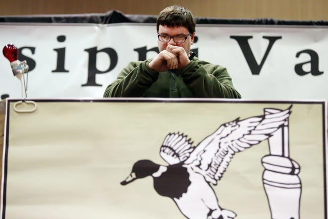 Jake Sieverding competes in the Iowa State Duck Calling contest at the 20th annual Mississippi Valley Callers Association Calling Classic, Saturday at the Pzazz Convention and Event Center in Burlington. [John Lovretta/thehawkeye.com]
