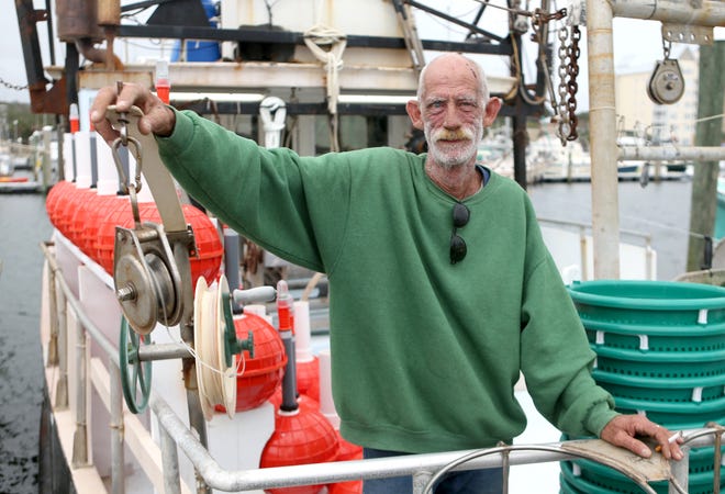 Carl Roby stands aboard the Cynthia Renee at the St. Andrews Marina. He has been a commercial fisherman since the 1970s, now concentrating on yellowfin tuna. [PATTI BLAKE/THE NEWS HERALD]