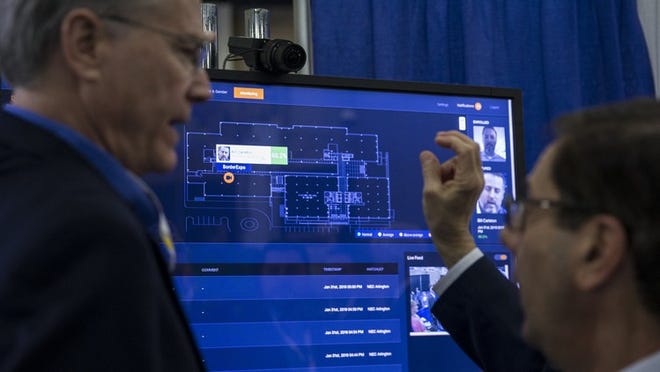 A representative with NEC Corporation of America explains the company’s facial recognition cameras and software during the Border Security Expo in San Antonio on Wednesday. NICK WAGNER / AMERICAN-STATESMAN