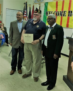 The American Legion Auxiliary recently hosted a "Welcome Home" luncheon for Vietnam veterans in Sebastian. American Legion Post 285 Edgewater Judge Advocate Joseph Robinson was an honoree.  Robinson served with the US Air Force 196-65.  He pinned with a medal by Medal of Honor Recipient Sgt. 1st Class Melvin Morris and received a citation from the Daughters of the American Revolution. Pictured from left, Rob Medina, community and military assistant for Congressman Bill Posey, Joseph Robinson and Sgt. 1st Class Melvin Morris. [Photo provided]