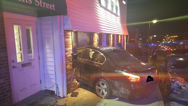 A car crashed into 99 Adams St. in Milton on Sunday night. Milton Police photo