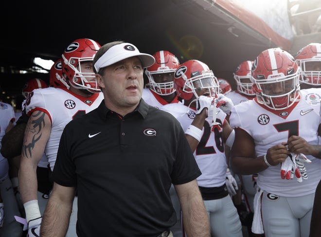 Georgia head coach Kirby Smart waits with his team to run onto the field before the Rose Bowl this season. There's a strange sense of calm that has replaced the tumult typically associated with this time of year on the college football recruiting calendar. [AP Photo/Jae C. Hong]
