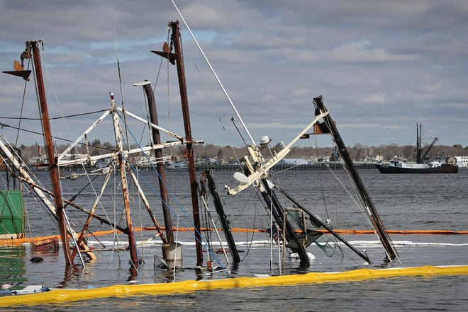 Two of Carlos Rafael fishing boats, Dinah Jane and Nemesis, sank tied at Leonard's Wharf in New Bedford. 

[ PETER PEREIRA/THE STANDARD-TIMES/SCMG ]
