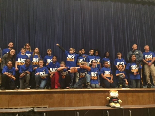 Fifth-graders at the Riverfront Middle School in Florence graduate from the police force's D.A.R.E. program. [COURTESY OF THE FLORENCE POLICE]