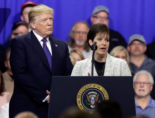 Deana Spoleti speaks as President Donald Trump listens during a speech on tax policy during a visit to Sheffer Corporation, Monday, Feb. 5, 2018, in Blue Ash, Ohio. (AP Photo/Evan Vucci)