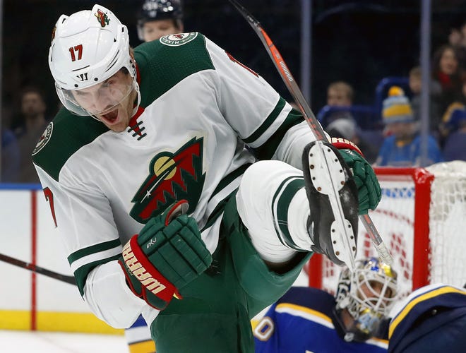 Minnesota's Marcus Foligno celebrates after scoring in the first period of the Wild's 6-2 victory over the St. Louis Blues on Tuesday night. [Jeff Roberson/The Associated Press]
