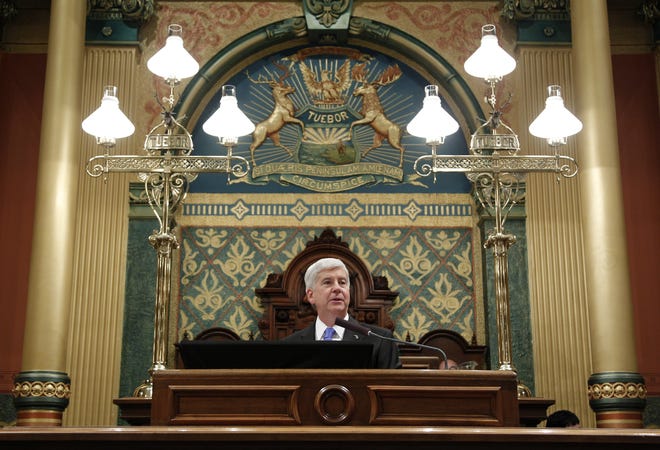 Michigan Gov. Rick Snyder delivers his State of the State address to a joint session of the House and Senate, Tuesday, Jan. 23, 2018, at the state Capitol in Lansing, Mich. Snyder announced on Wednesday his plans for the 2018-19 budget. (AP Photo/Al Goldis)