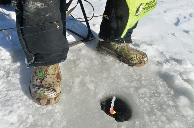 RON JOHNSON/JOURNAL STAR FILE PHOTO

Ice fishermen covered Lake Camelot for the 2014 ice fishing derby.