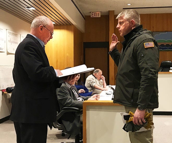 Republican Christopher Merola was sworn in Monday night to the 4th Ward City Council seat by Mayor Bill Boland. [Jeff Smith/The Leader]