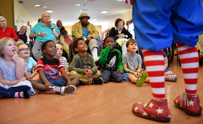 Circus Arts Conservatory clown Chuck Sidlow and his wife Noriko are a regular part of the intergenerational programming at The Pines, which brings together elderly residents and children from the organization's preschool for music, art and horticulture sessions. [HERALD-TRIBUNE STAFF PHOTO / MIKE LANG]
