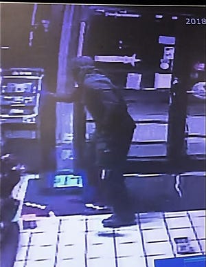 The Sarasota County Sheriff's Office is asking the public for help in identifying a burglar who broke into the BP gas station at 4949 S. Tamiami Trail on Jan. 17 at about 2:30 a.m. and stole a cash register and ATM. [Provided by Sarasota County Sheriff's Office]