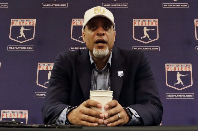 In this Feb. 19, 2017, file photo, Tony Clark, executive director of the Major League Players Association, answers questions at a news conference in Phoenix. Clark said Tuesday, Feb. 6, 2018, that the number of rebuilding teams and unsigned free agents in a historically slow market "threatens the very integrity of our game." [THE ASSOCIATED PRESS / MORRY GASH]