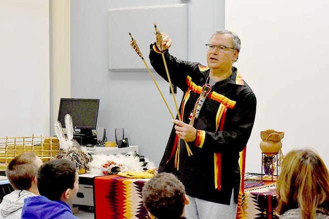 Oneida Indian Nation Assistant Director of Education Randy Phillips explains to Herkimer-Fulton-Hamilton-Otsego BOCES special education students how Iroquois arrows were feathered to make them spin through the air to increase speed and enter further into an animal during a hunt. Phillips presented to students Jan. 23 at the Herkimer BOCES William E. Busacker Complex in Herkimer.     

[Submitted Photo]