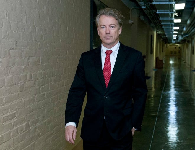 Sen. Rand Paul, R-Ky., walks to his office after speaking in the senate floor, at the Capitol, Thursday, Feb. 8, 2018.