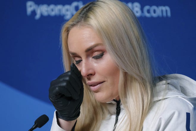 American Lindsey Vonn wipes away a tear with a gloved hand at a news conference Friday. [The Associated Press]