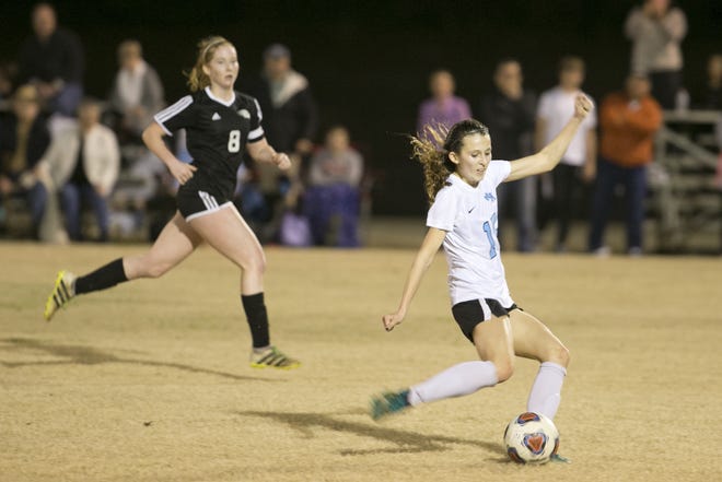North Bay Haven's Sierra Eisenbrown gets off a shot with South Walton's Mia McAdams trailing the play on Friday night in South Walton's 1-0 victory at Harders Park. [JOSHUA BOUCHER/THE NEWS HERALD]