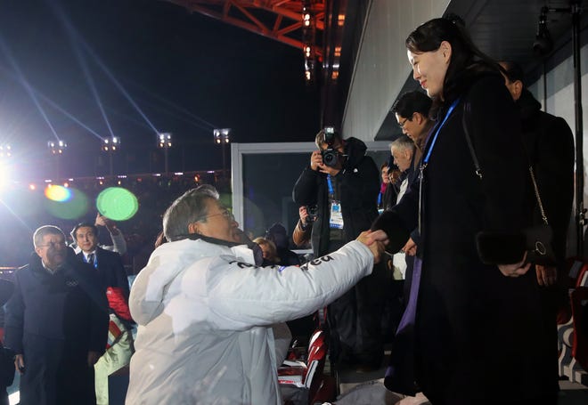 South Korean President Moon Jae-in, left, shakes hands with North Korean leader Kim Jong Un's younger sister Kim Yo Jong during the opening ceremony of the 2018 Winter Olympics in Pyeongchang, South Korea, Friday, Feb. 9, 2018. [Kim Ju-sung/Yonhap via AP]
