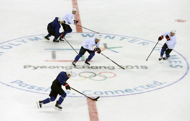 Members of the United States men's hockey team practice ahead of the 2018 Winter Olympics in Gangneung, South Korea, on Friday, Feb. 9, 2018. [Kiichiro Sato/Associated Press]