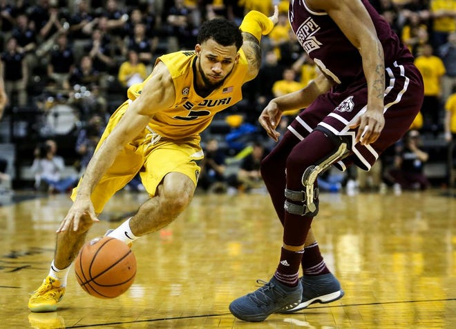 Kassius Robertson drives by a Mississippi State defender in Saturday's 89-85 overtime win. (Hunter Dyke/Columbia Daily Tribune)