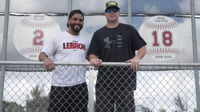 Major leaguers and Palm Beach Central alums Devon Travis (left) and Brad Peacock were honored by their Wellington school on Saturday. (Andres Leiva / The Palm Beach Post)