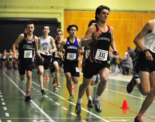 Old Rochester's Geoffrey Noonan keeps up his pace running the 1,000 meter during the SCC Championship Track Meet held at GNB V0c-Tech in New Bedford. The Bulldogs won by a half-point. [DAVID W. OLIVEIRA/STANDARD-TIMES SPECIAL/SCMG]
