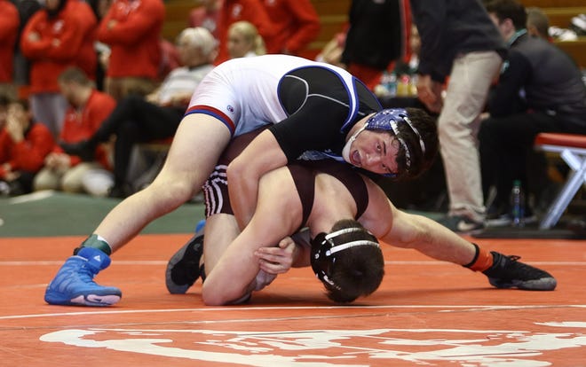 Tuslaw's Stephen Skeens has control over Seth Moore of Genoa in their 170 pound finals match.

 (IndeOnline.com / Kevin Whitlock)