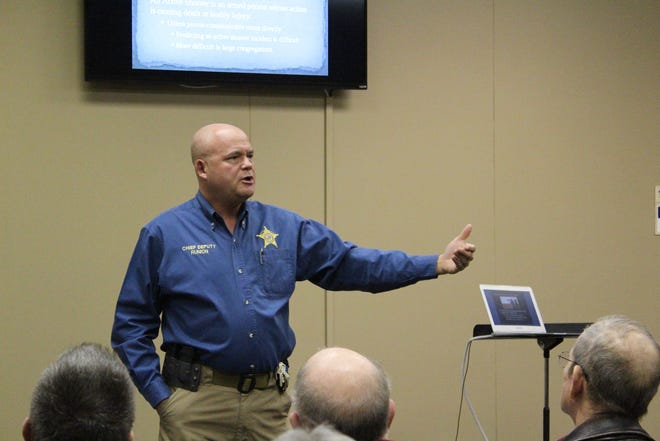 Sebastian County Sheriff's Office Chief Deputy Hobe Runion discusses what to do if an active shooter enters a church at the Regional Church Safety Seminar on Saturday morning in Grand Avenue Baptist Church. [TIMES RECORD/MAX BRYAN]